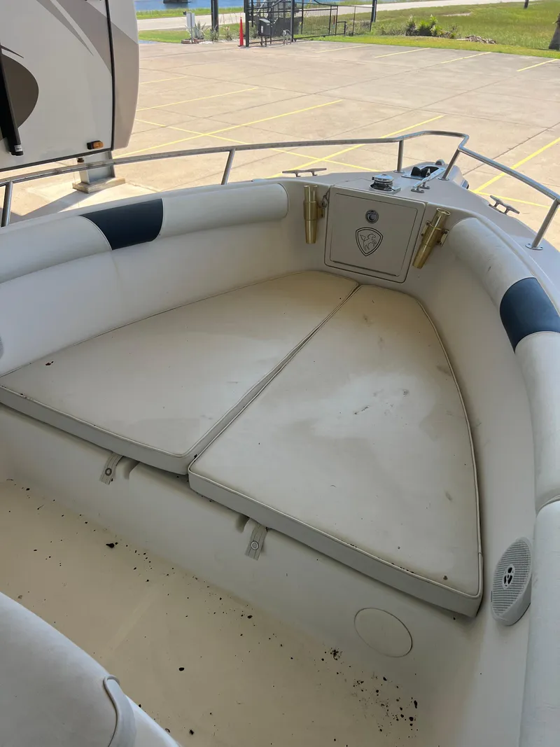 Slide: The Image of 2007 Century 2600 CC boat interior with cushioned seating and storage compartment. - 39
