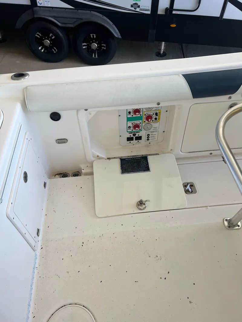 Slide: The Image of 2007 Century 2600 CC boat interior with control panel and seating area. - 44