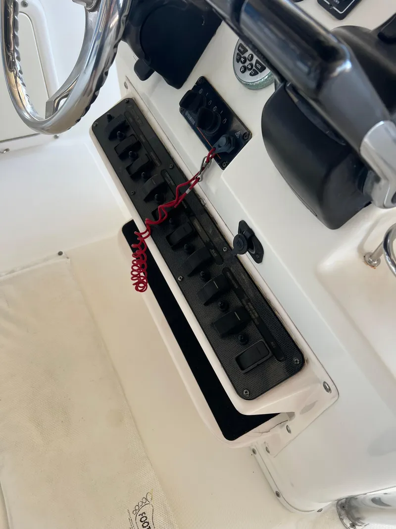 Slide: The Image of 2007 Century 2600 CC boat dashboard with steering wheel and control panel. - 5