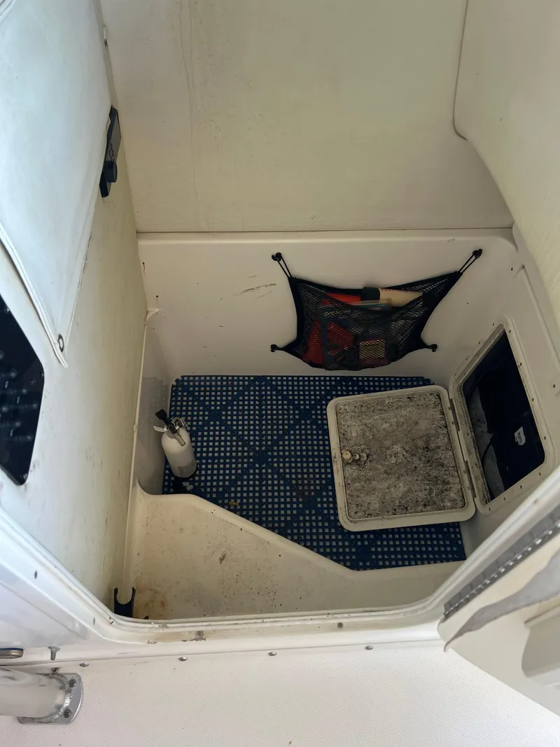 Slide: The Image of Interior of a 2007 Century 2600 CC boat with storage compartments and netting. - 7