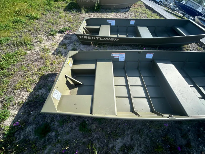 Slide: The Image of 2025 Crestliner CR1240 boat on grass, showcasing interior layout and design. - 6