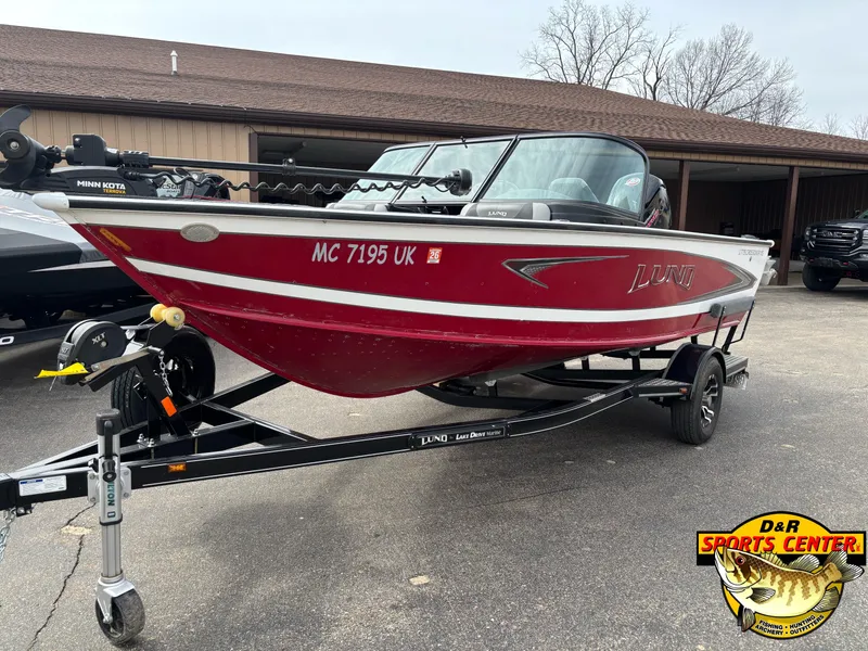 Slide: The Image of Red 2020 Lund 1775 Crossover XS boat on trailer at D&R Sports Center. - 2