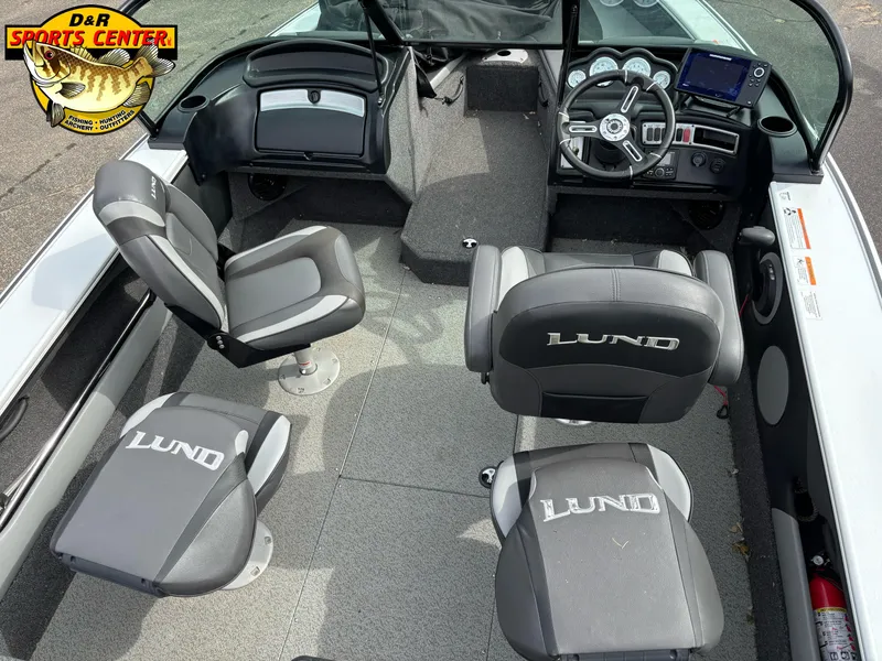 Slide: The Image of 2020 Lund 1775 Crossover XS boat interior with seating and dashboard view. - 6