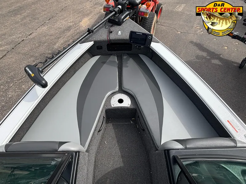 Slide: The Image of 2020 Lund 1775 Crossover XS boat interior with gray seating and fishing equipment. - 8