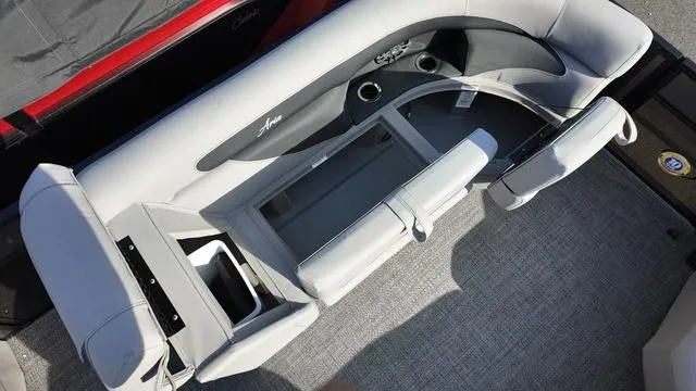 Slide: The Image of 2025 Barletta Aria A22CC boat interior with gray seating and cup holders. - 11