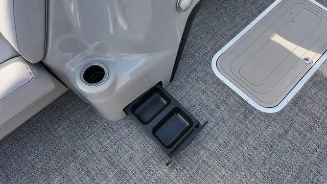 Slide: The Image of Cup holder and storage on 2025 Barletta Aria A22CC boat interior. - 12