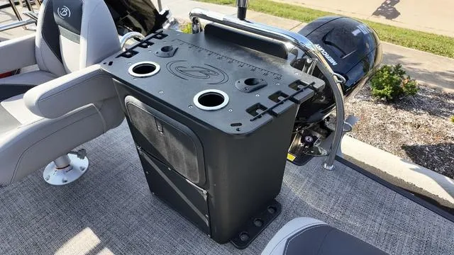 Slide: The Image of 2025 Barletta Aria A22CC boat interior with seating and storage console. - 22