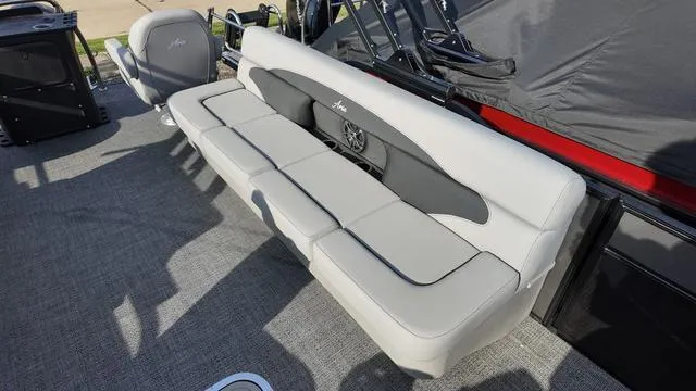 Slide: The Image of 2025 Barletta Aria A22CC boat interior with gray seating and carpeted flooring. - 24
