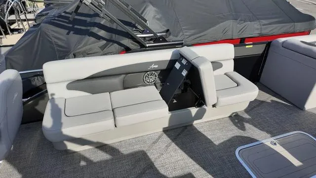 Slide: The Image of 2025 Barletta Aria A22CC boat interior with gray seating and speaker system. - 27