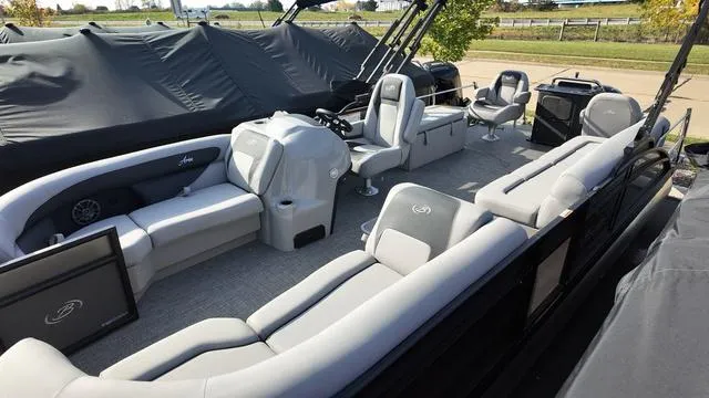 Slide: The Image of 2025 Barletta Aria A22CC pontoon boat with spacious seating and modern design. - 6