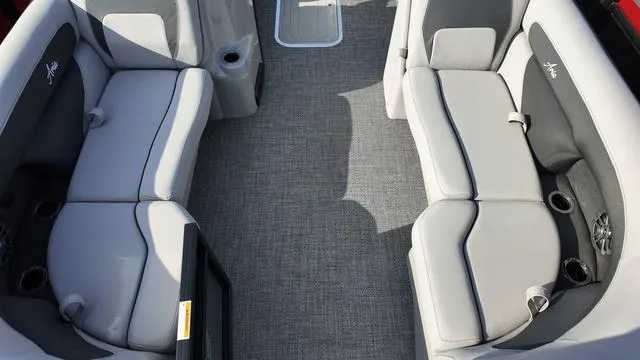 Slide: The Image of 2025 Barletta Aria A22CC boat interior with gray seating and carpeted flooring. - 7