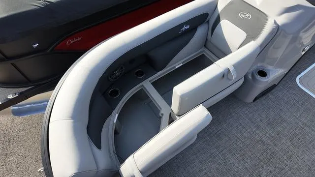 Slide: The Image of Luxurious seating on 2025 Barletta Aria A22CC boat with cup holders and storage. - 9