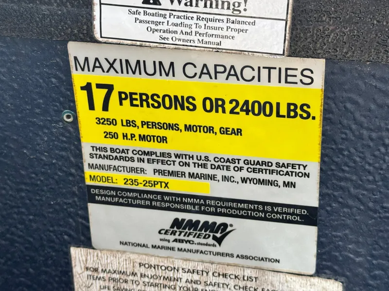 Slide: The Image of Boat capacity label: 17 persons or 2400 lbs, Premier 235 Grand Majestic LTD, 2010 model. - 13