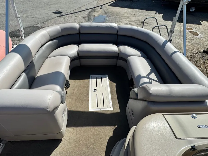 Slide: The Image of Luxurious seating on 2010 Premier 235 Grand Majestic LTD pontoon boat, featuring plush gray upholstery. - 14