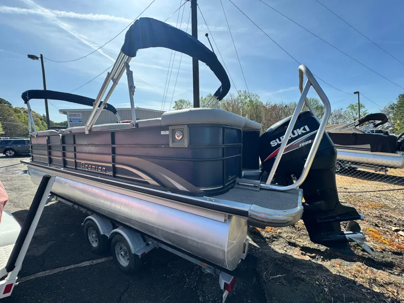 Slide: The Image of Pontoon boat, Premier 235 Grand Majestic LTD 2010, with Suzuki outboard motor on trailer. - 4