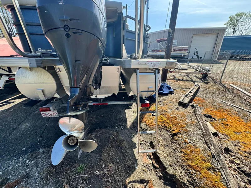 Slide: The Image of Rear view of a 2010 Premier 235 Grand Majestic LTD boat with outboard motor and ladder. - 6