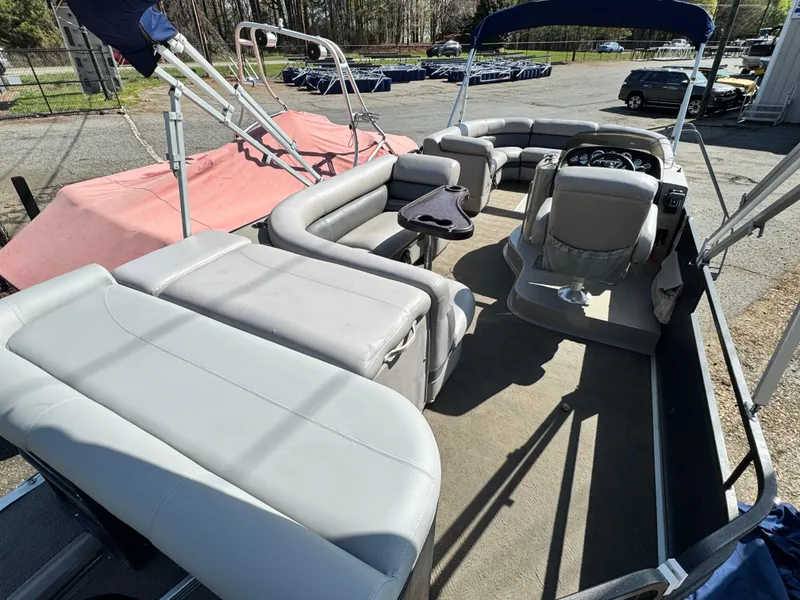 Slide: The Image of Pontoon boat interior, Premier 235 Grand Majestic LTD, 2010 model, spacious seating, outdoor setting. - 7