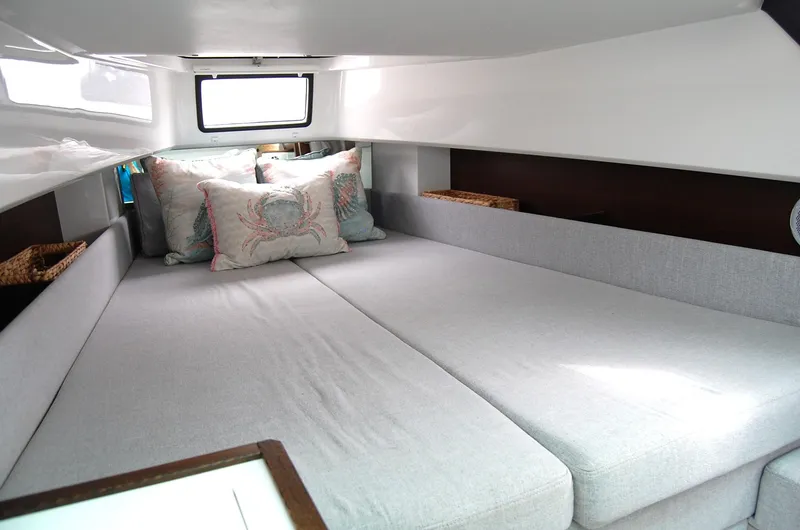 Slide: The Image of Interior cabin of 2019 Axopar 37 SC with cozy bedding and pillows. - 19