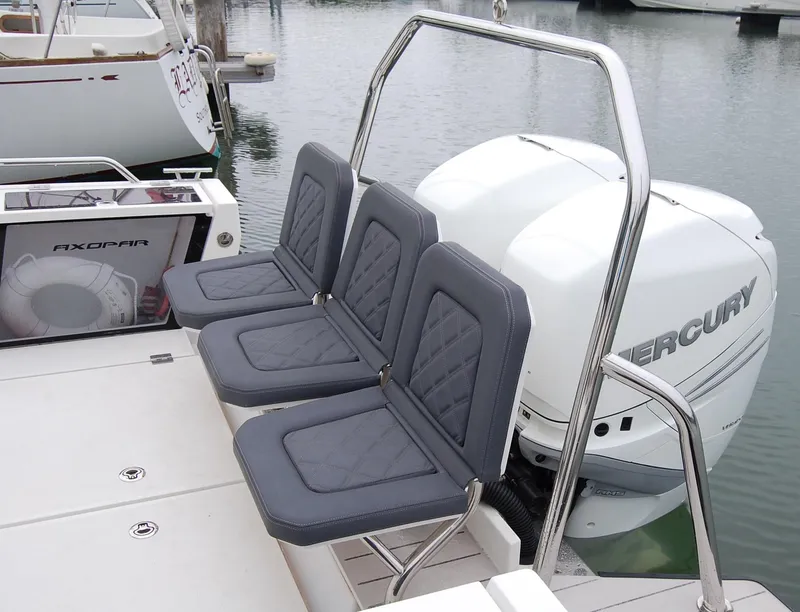 Slide: The Image of 2019 Axopar 37 SC boat with Mercury engine and three cushioned seats. - 5