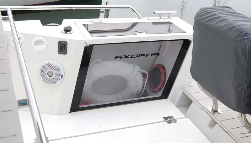 Slide: The Image of 2019 Axopar 37 SC boat interior with speaker and storage compartment. - 6