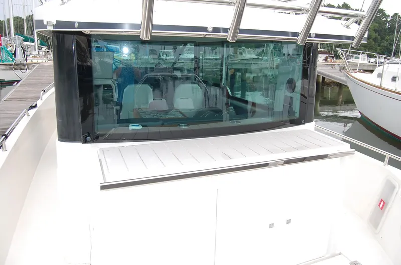 Slide: The Image of 2019 Axopar 37 SC boat with sleek design, docked at a marina. - 9