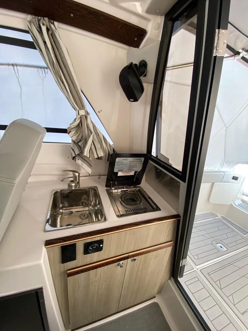 Slide: The Image of Compact kitchen area in 2025 Solara S-250 C boat with sink and stove. - 12