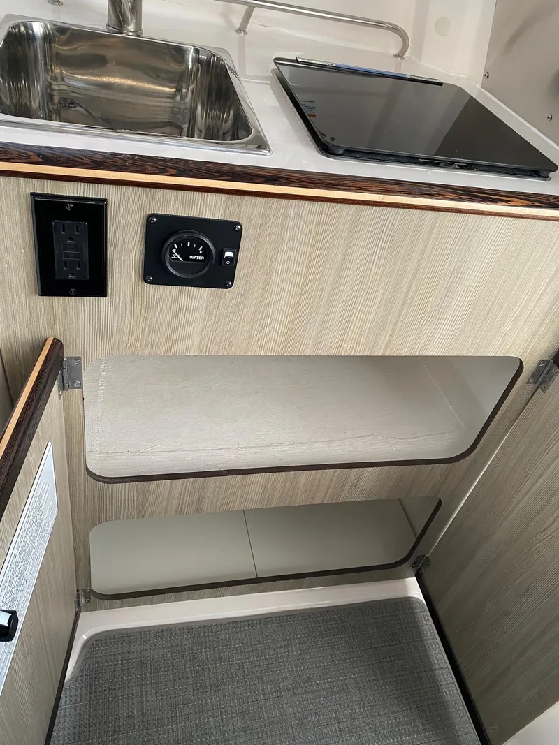 Slide: The Image of Compact kitchen area in 2025 Solara S-250 C with sink and stove. - 13