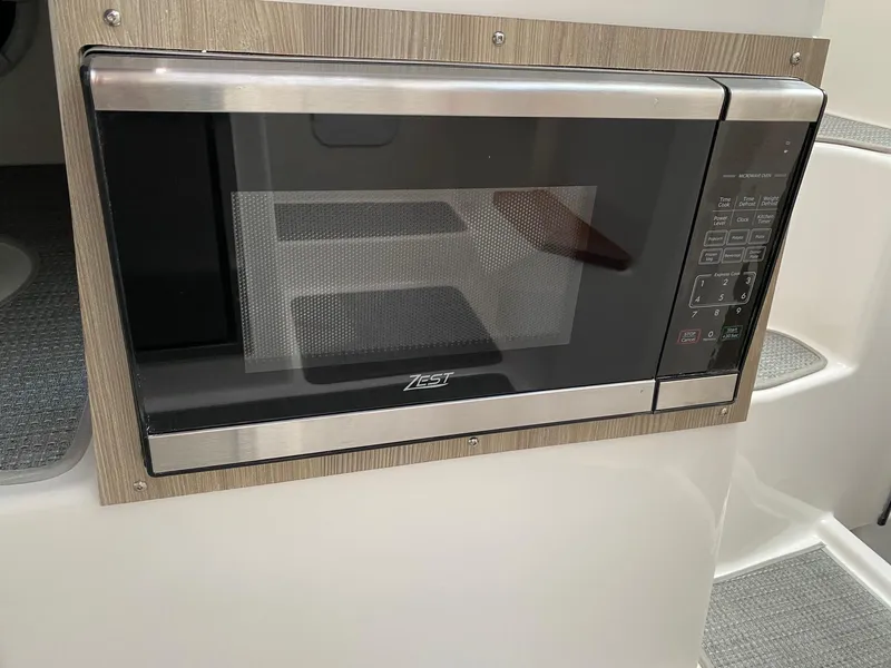 Slide: The Image of Built-in microwave in Solara S-250 C, 2025 model, with sleek stainless steel design. - 15