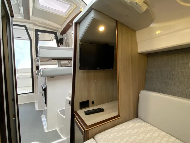Slide: The Image of Interior of 2025 Solara S-250 C boat with modern amenities and cozy seating. - 21