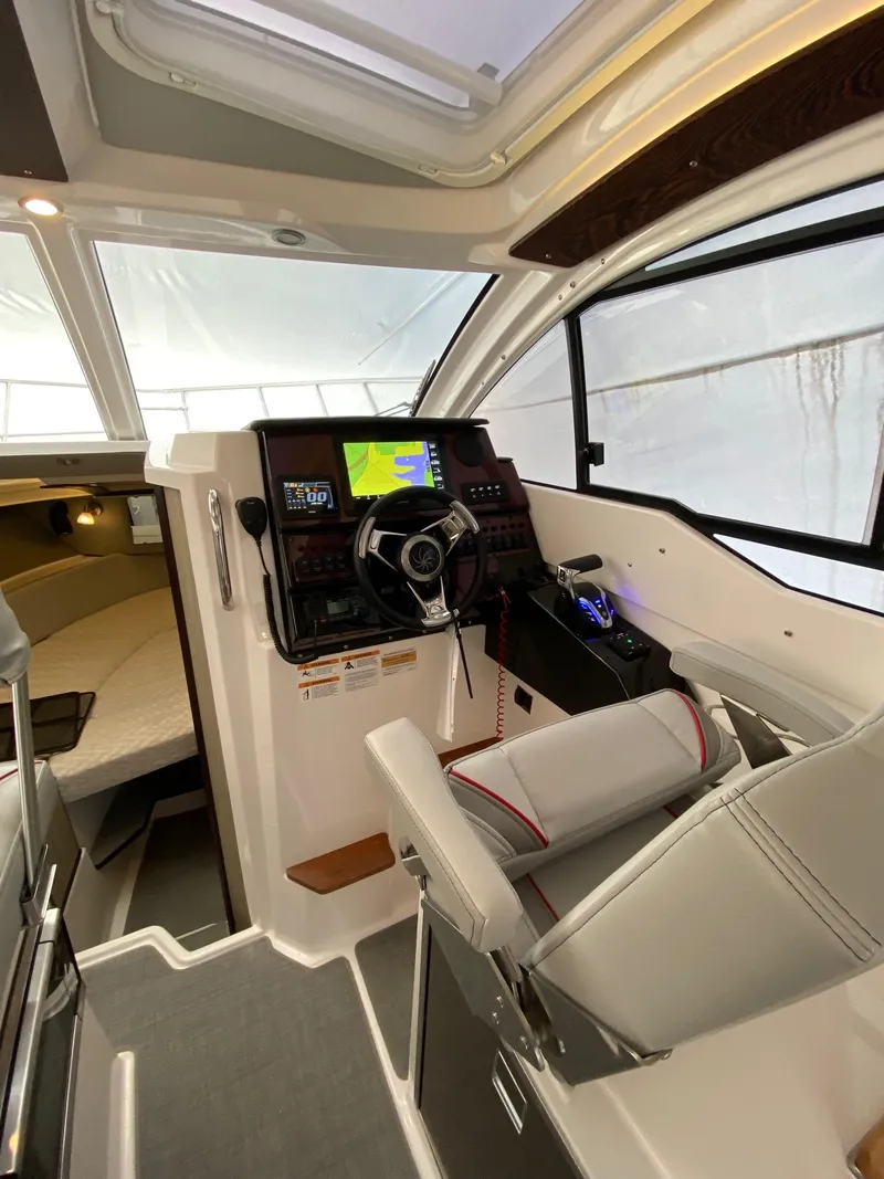 Slide: The Image of Interior of 2025 Solara S-250 C boat with modern helm and navigation system. - 22