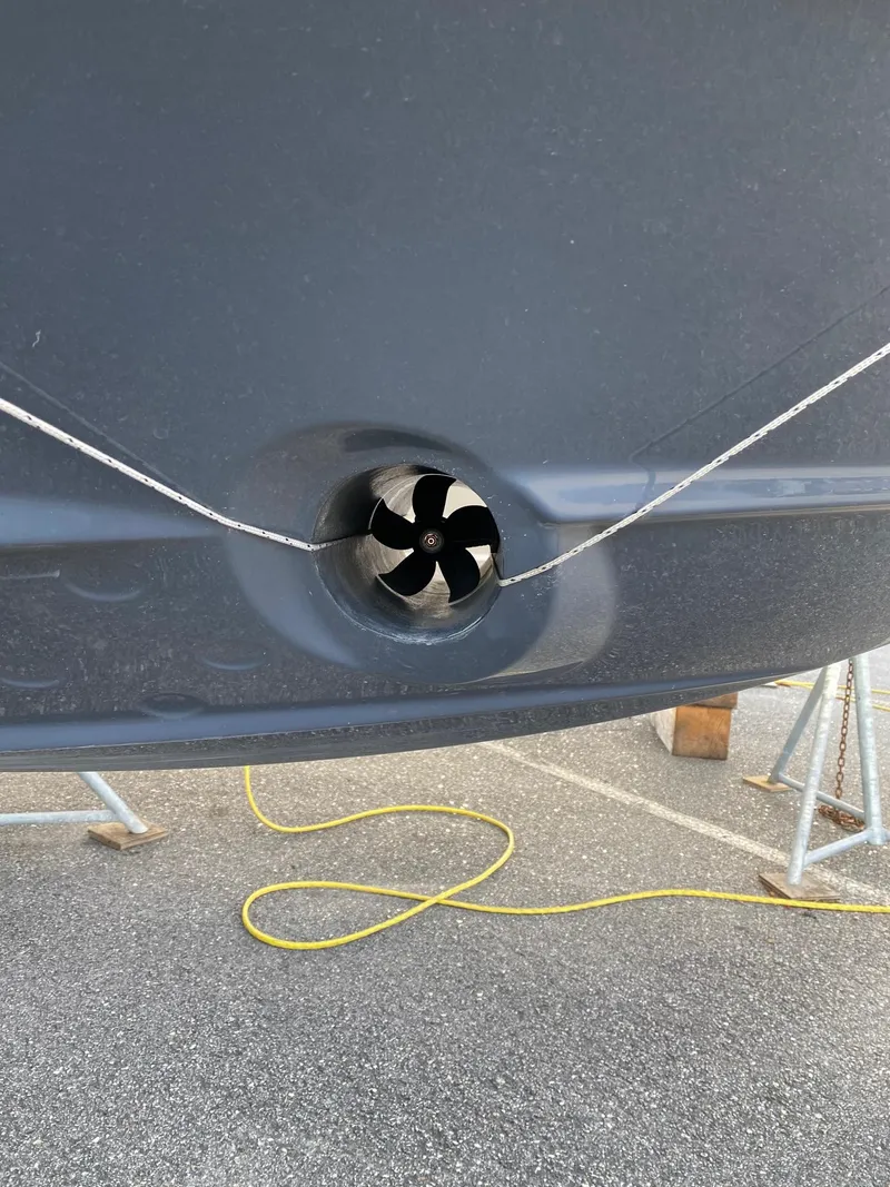 Slide: The Image of Close-up of Solara S-250 C 2025 boat propeller on display stand. - 28