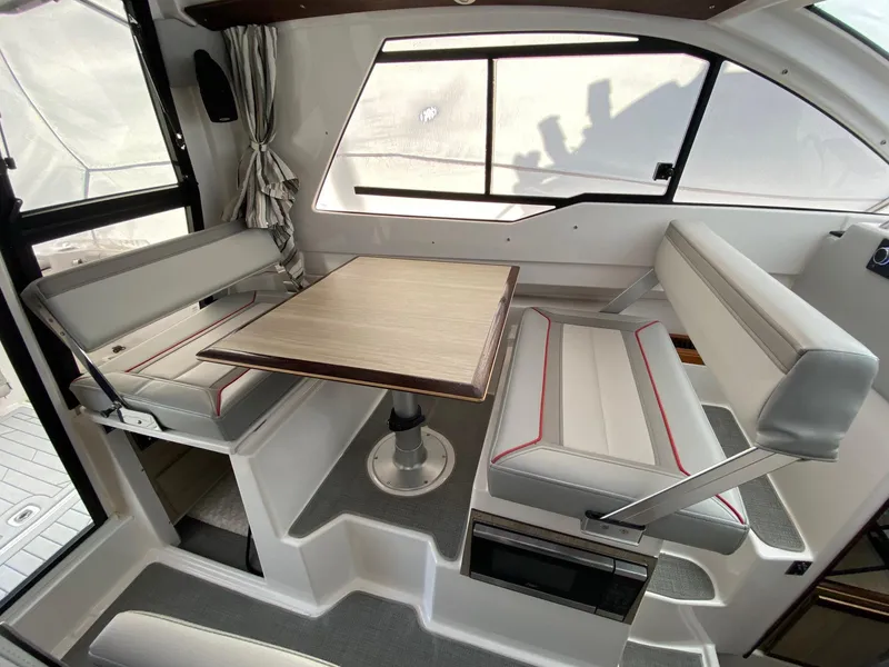 Slide: The Image of Interior of 2025 Solara S-250 C boat with modern seating and table arrangement. - 7