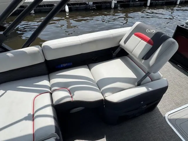 Slide: The Image of 2023 Barletta CORSA 23 UA boat interior with plush seating by the water. - 11