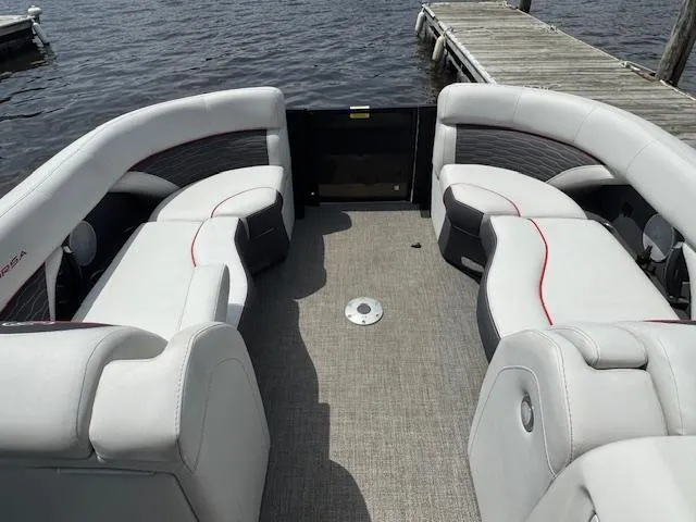 Slide: The Image of 2023 Barletta CORSA 23 UA pontoon boat interior with plush seating and lake view. - 16