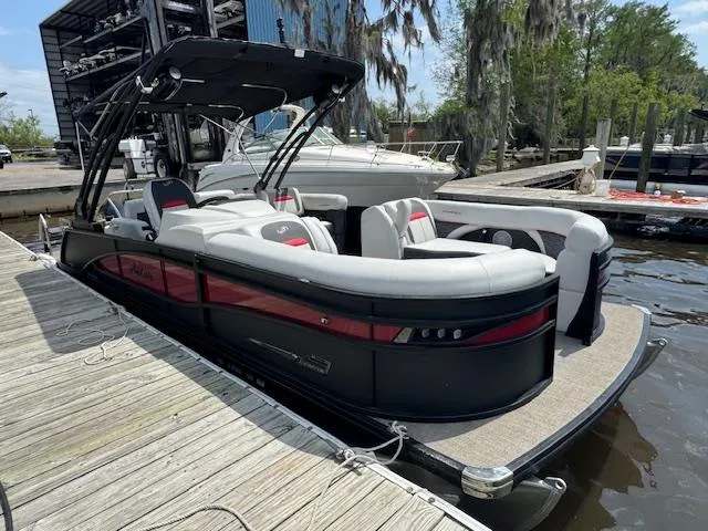 Slide: The Image of 2023 Barletta CORSA 23 UA pontoon boat docked at marina. - 5