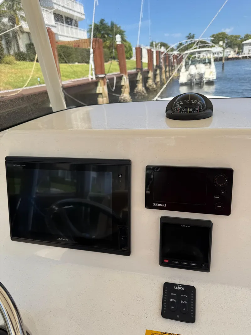 Slide: The Image of 2018 Key West Billistic 281 Center Console dashboard with navigation instruments. - 12