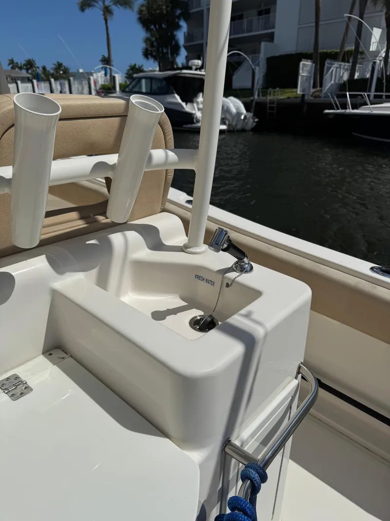 Slide: The Image of 2018 Key West Billistic 281 Center Console boat with rod holders and sink. - 30