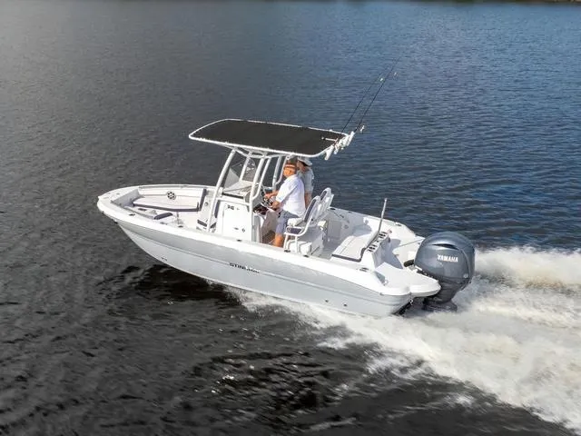 The Image of 2025 Stingray 216CC boat cruising on water with Yamaha outboard engine. - 1