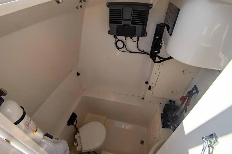 Slide: The Image of Interior of 1997 Jupiter 31 Open boat with toilet and equipment storage. - 17