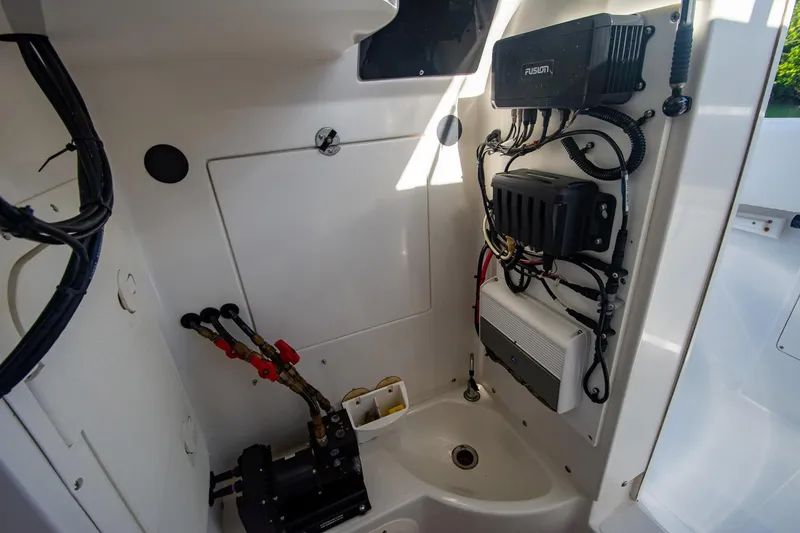 Slide: The Image of Interior view of a 1997 Jupiter 31 Open boat's electrical and mechanical components. - 19