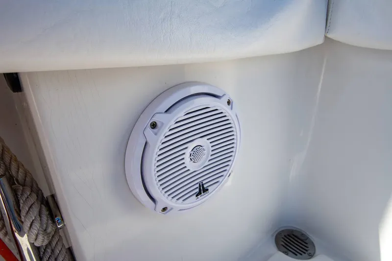 Slide: The Image of White speaker on a 1997 Jupiter 31 Open boat interior. - 22