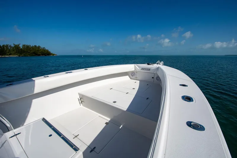 Slide: The Image of 1997 Jupiter 31 Open boat on calm blue sea under clear sky. - 27