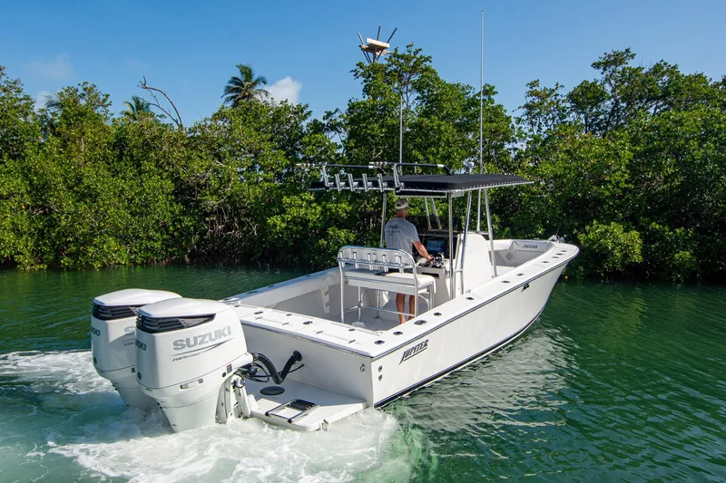 Slide: The Image of 1997 Jupiter 31 Open boat cruising in lush, tropical waters with dual Suzuki engines. - 3