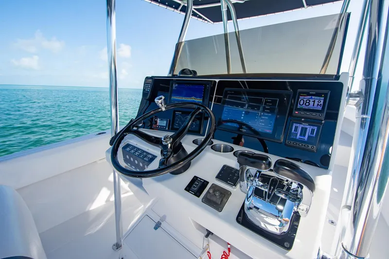 Slide: The Image of Control panel of a 1997 Jupiter 31 Open boat with ocean view. - 32