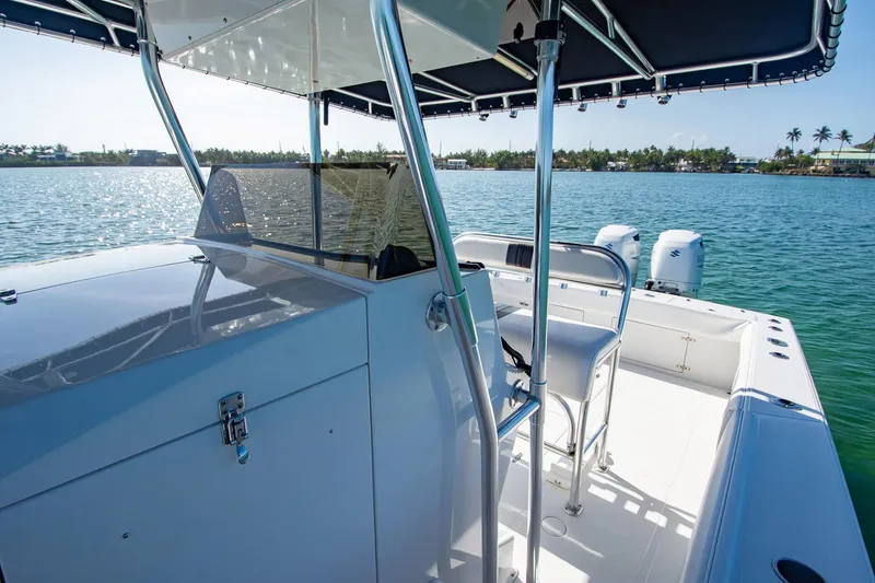 Slide: The Image of 1997 Jupiter 31 Open boat on water, featuring sleek design and dual engines. - 34