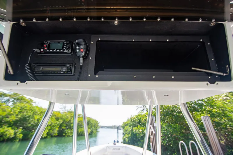 Slide: The Image of 1997 Jupiter 31 Open boat console with radio equipment, surrounded by lush greenery. - 37