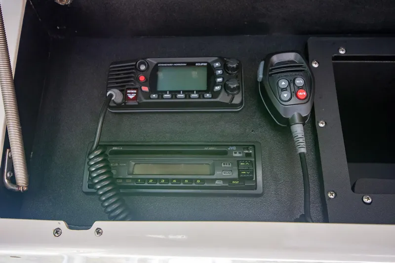 Slide: The Image of Control panel of a 1997 Jupiter 31 Open boat with radio and communication equipment. - 38