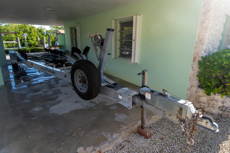 Slide: The Image of Boat trailer parked under a covered area, suitable for a 1997 Jupiter 31 Open. - 39