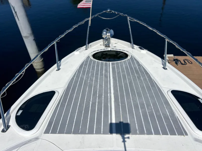 Slide: The Image of 2022 Regal 28 Express boat deck with sleek design and American flag in background. - 26
