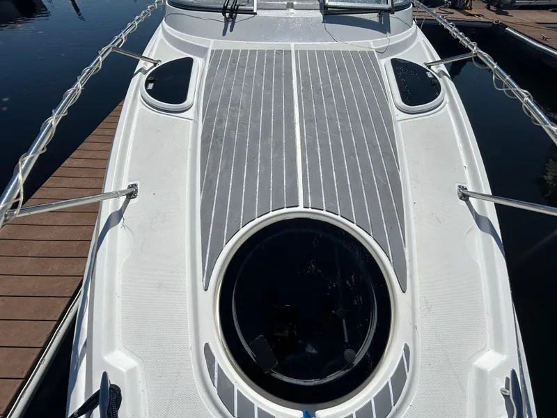 Slide: The Image of 2022 Regal 28 Express boat deck with sleek design and circular hatch. - 27